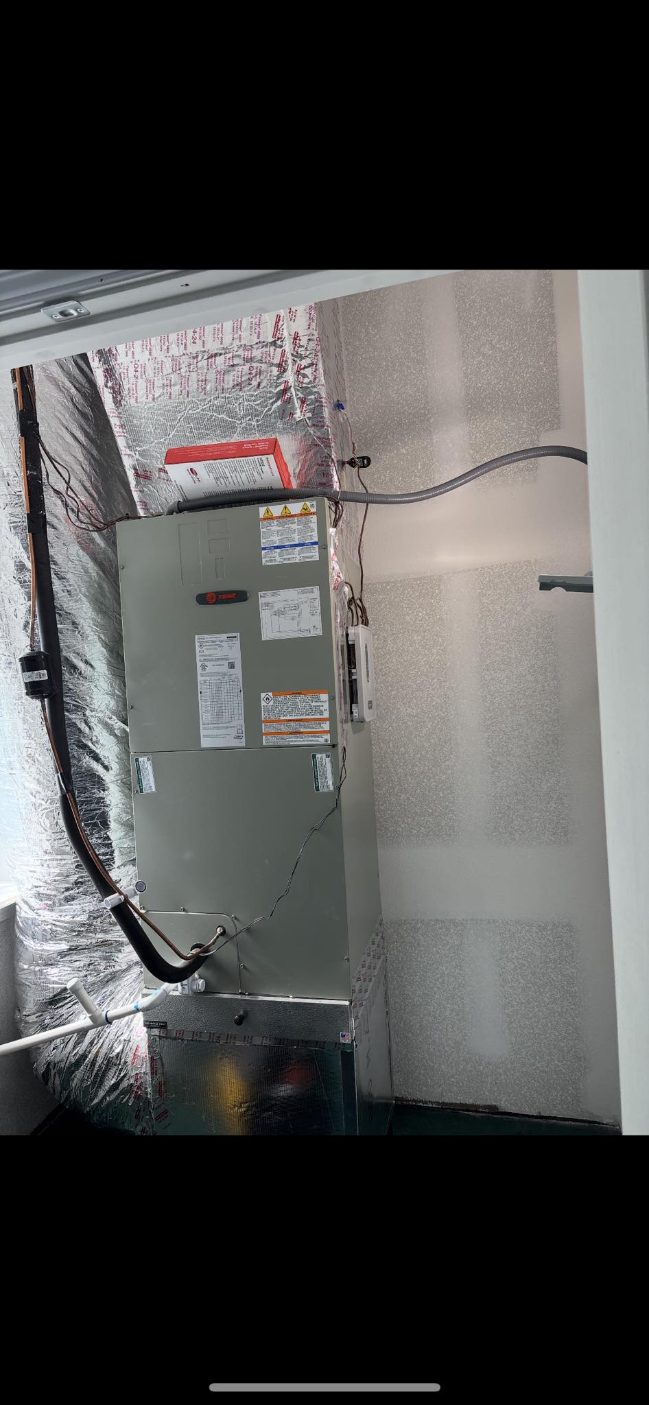Dual York air handlers installed side by side in attic